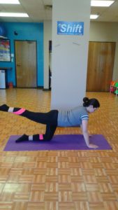 Young woman doing exercises at SHIFT Minneapolis studio