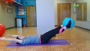 Young woman doing exercises at SHIFT Minneapolis studio
