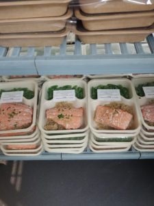 Prepackaged meals on metal racks