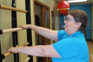 Tammy climbing exercise ladder at Minneapolis fitness studio