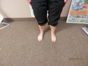 woman's feet on carpet